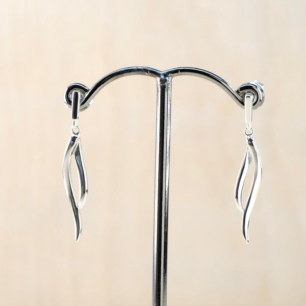Delicate Polished Silver Curved Drop Earrings by JB Designs.