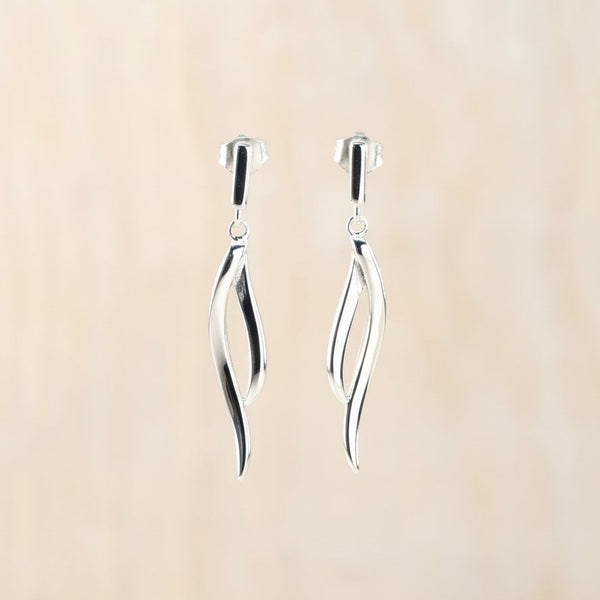 Delicate Polished Silver Curved Drop Earrings by JB Designs.
