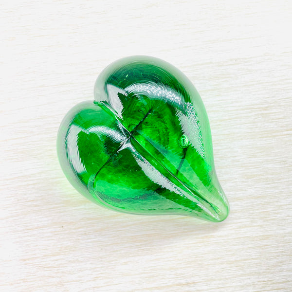 Deep emerald green coloured glass heart with a little bubbleand different shades of green showing through.