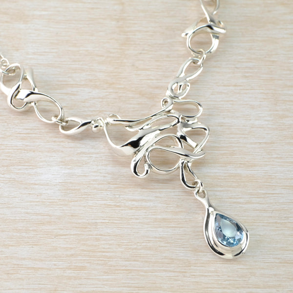 Art Nouveau Inspired Blue Topaz and Silver Statement Necklace.