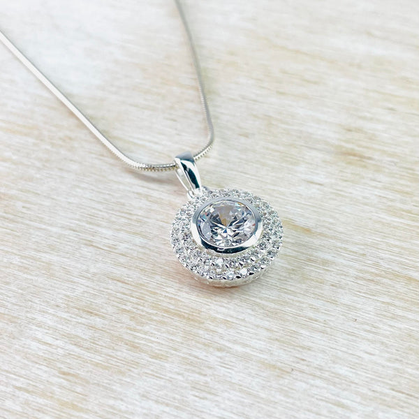 Circular Sterling Silver and Pavé set CZ Pendant.