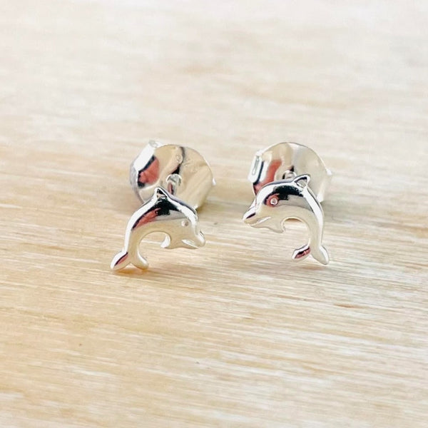 Jumping dolphins in high polished silver.