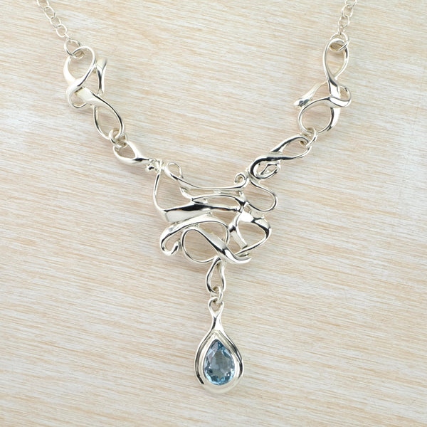 Art Nouveau Inspired Blue Topaz and Silver Statement Necklace.