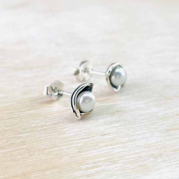 Sterling Silver and Round Freshwater Pearl Stud Earrings.