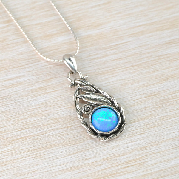 Sterling Silver and Opal Tear Drop Pendant in an Art Nouveau Style.