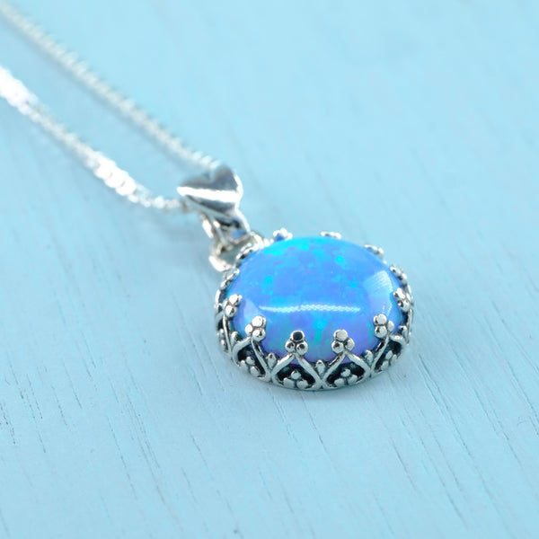 Decorated Round Sterling Silver and Opal Pendant.
