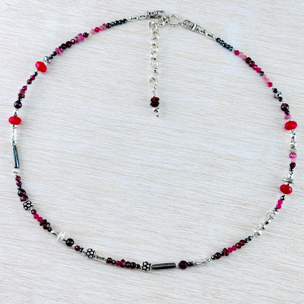 Asymetrical Garnet, Ruby, Ruby Quartz, Pink Tourmaline, Dyed Kyanite and Sterling Silver Bead Necklace by Emily Merrix.