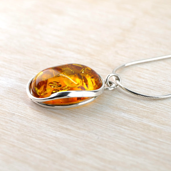 Oval Baltic Amber and Sterling Silver Pendant.