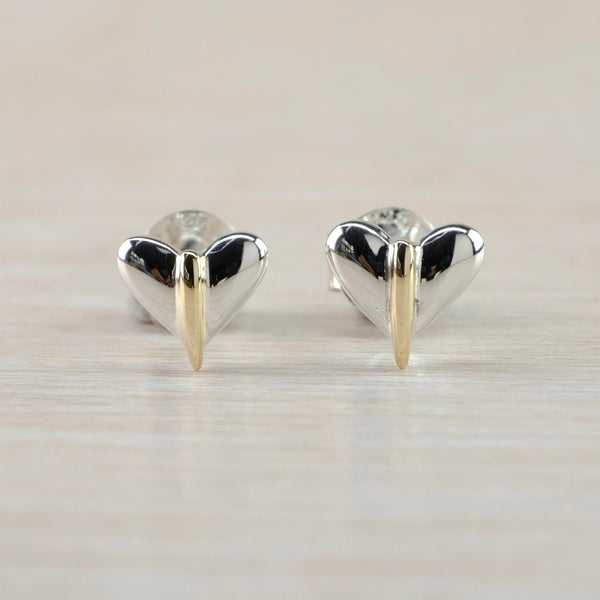 High polished heart shaped studs with a gold stripe down the middle which extends longer than the bottom outline of the heart.