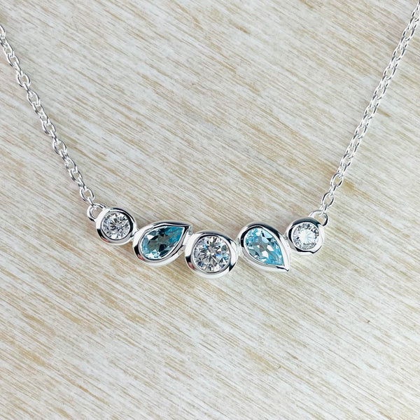 Contemporary Cubic Zirconia, Blue Topaz and Sterling Silver Necklace by JB Designs.