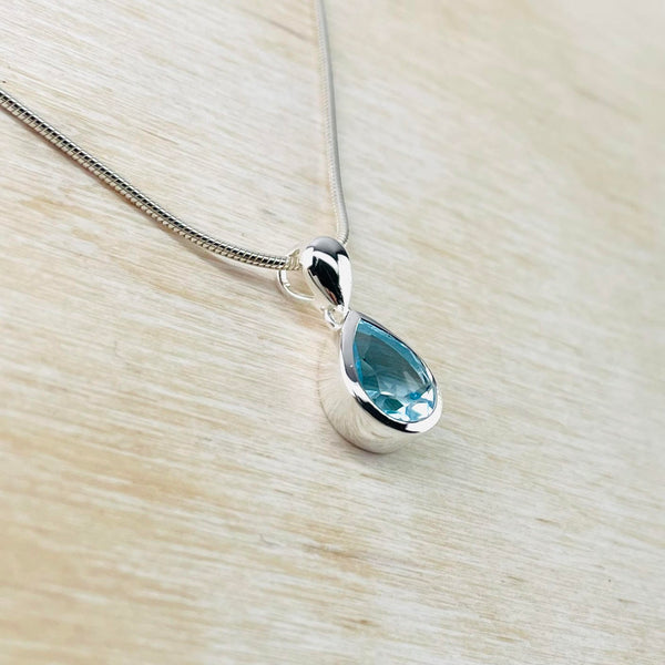 Tear Drop Blue Topaz and Sterling Silver Pendant by JB Designs.