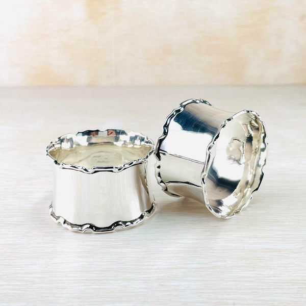 Two highly polished and shiny napkin rings.  No engraving but intetesting shaping to the rims. Almost a castellated design.