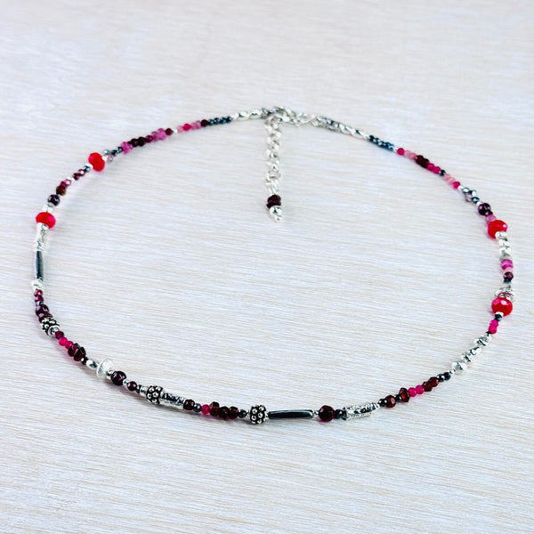 Asymetrical Garnet, Ruby, Ruby Quartz, Pink Tourmaline, Dyed Kyanite and Sterling Silver Bead Necklace by Emily Merrix.
