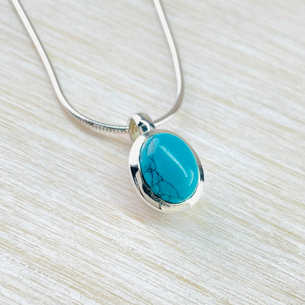 Small Chunky Sterling Silver and Oval Turquoise Pendant.