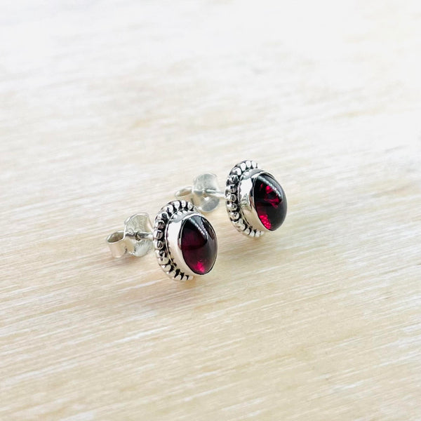 Oval Sterling Silver and Garnet Stud Earrings.