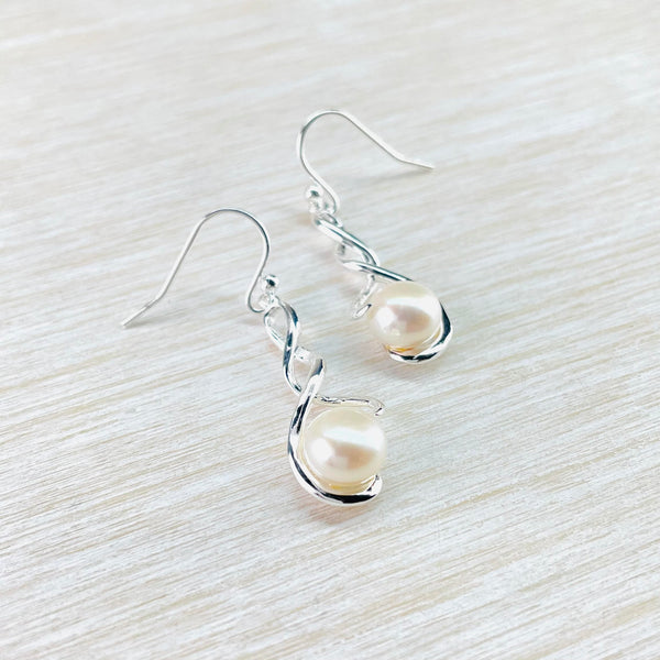 Double Twist Sterling Silver Drop Earrings with White Pearl.