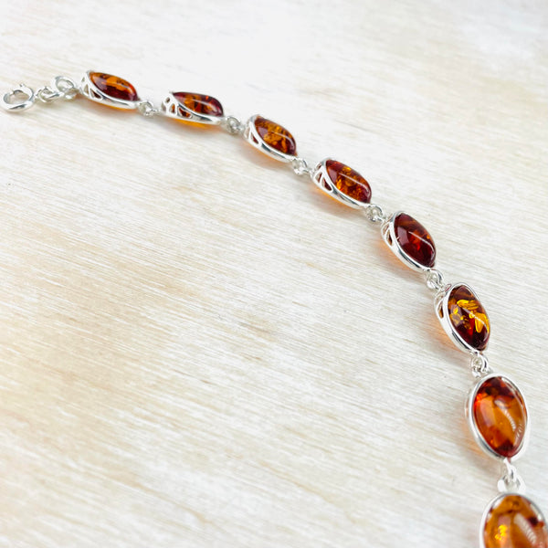 Sterling Silver and Oval Cognac Amber Link Bracelet.