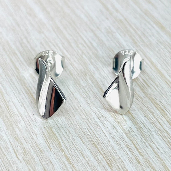 Triangular shape earrings with the top piece folded down  amd matt.