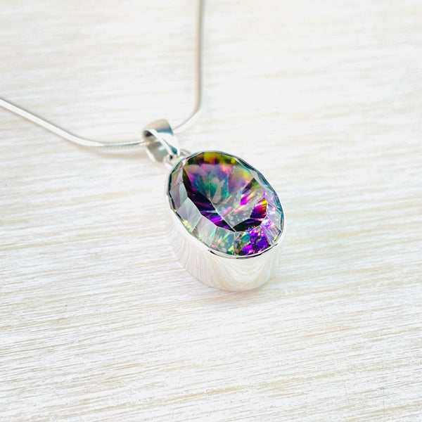Oval Sterling Silver and Mystic Topaz Pendant.
