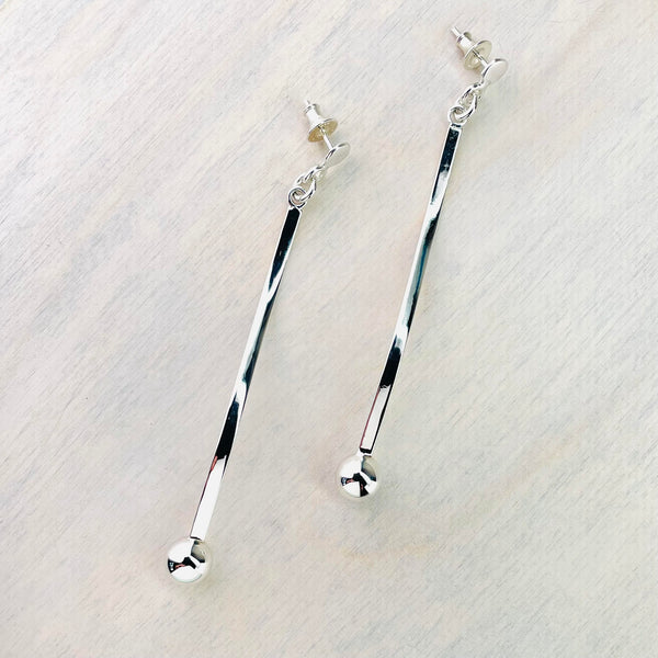 Long Silver Wavy Stick and Ball Drop Earrings.
