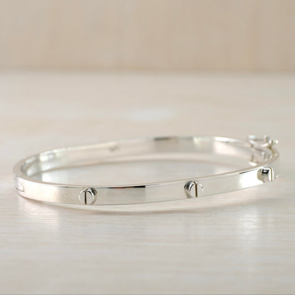Polished Silver Locking Bangle with Screwhead Details.