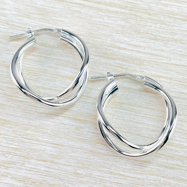 Each earring is formed of two slightly off circles cossing over each other at the bottom.