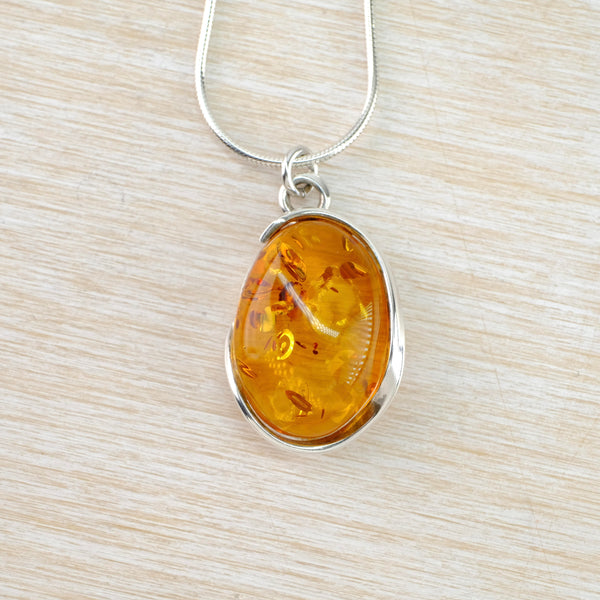 Oval Baltic Amber and Sterling Silver Pendant.