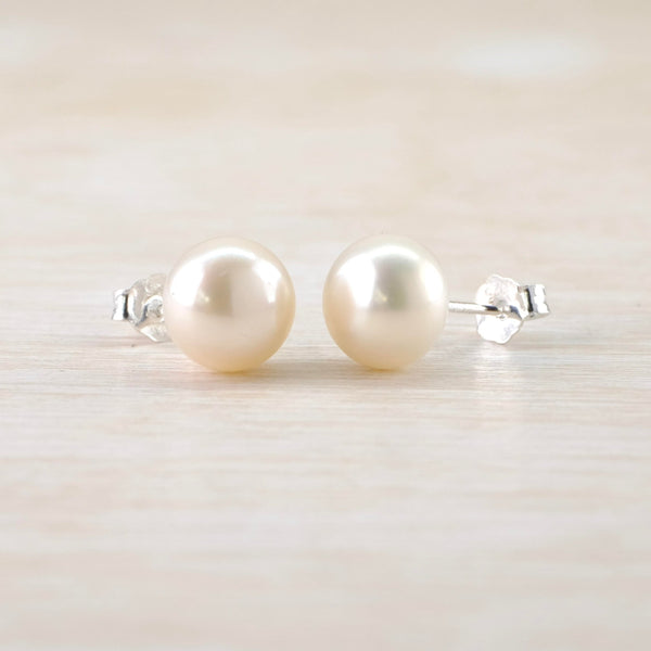 Very simple round pearls with a pretty sheen set on a silver post.