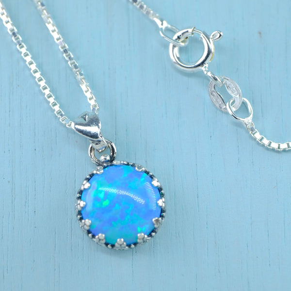 Decorated Round Sterling Silver and Opal Pendant.