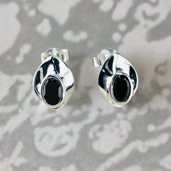 Contemporary Sterling Silver and Black Onyx Stud Earrings.