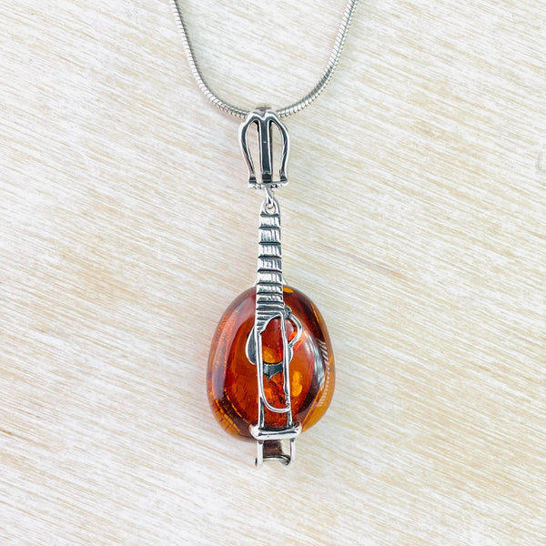 Sterling Silver and Amber Stringed Instrument Pendant.