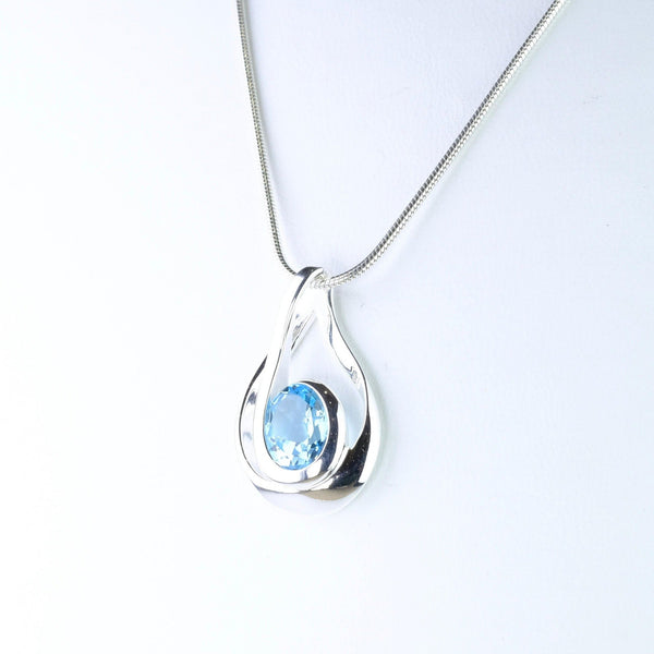 Contemporary Organic Blue Topaz and Silver Pendant.