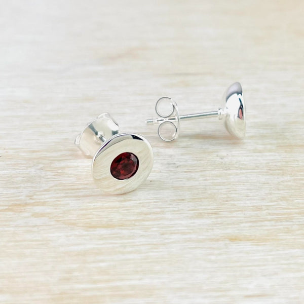 Round Sterling Silver and Garnet Stud Earrings.