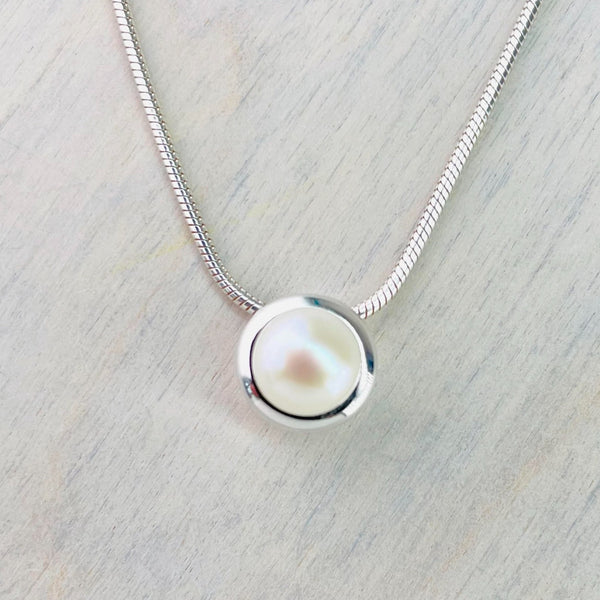 Simple Round Sterling Silver and Fresh Water Pearl Pendant by JB Designs.