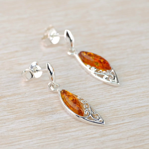 Cognac Amber and Decorative Sterling Silver Drop Earrings .