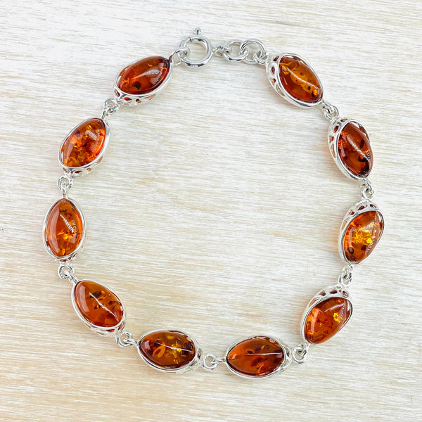 Sterling Silver and Oval Cognac Amber Link Bracelet.