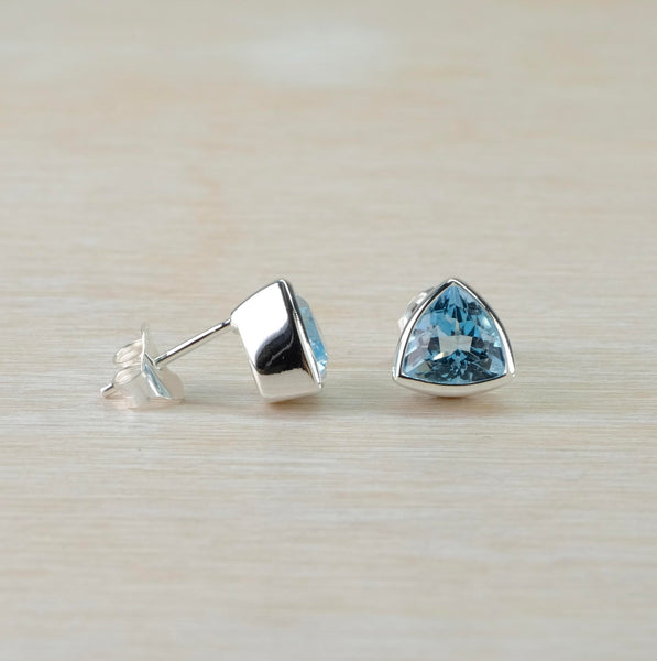 Sterling Silver and Blue Topaz 'Trillion Cut' Stud Earrings by JB Designs.