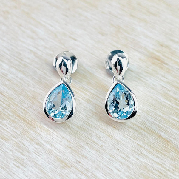 Tear Drop Blue Topaz and Silver Stud Earrings by JB Designs.