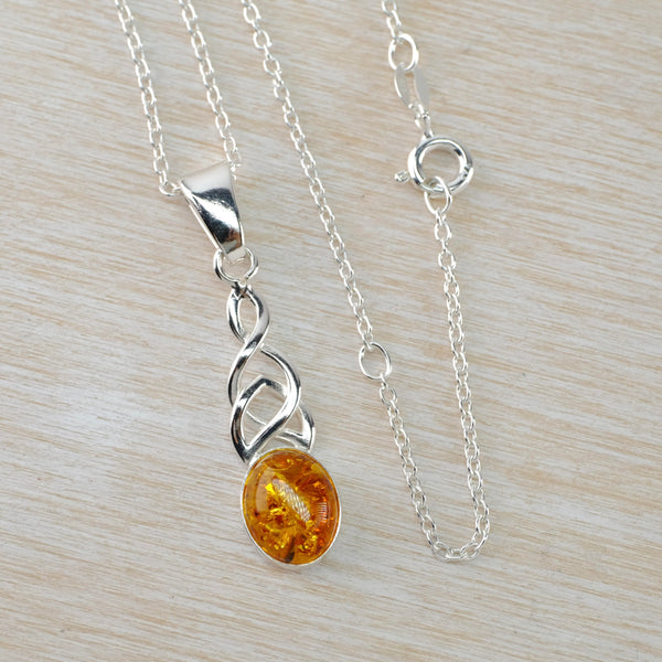 Celtic Design Sterling Silver and Oval Amber Pendant.