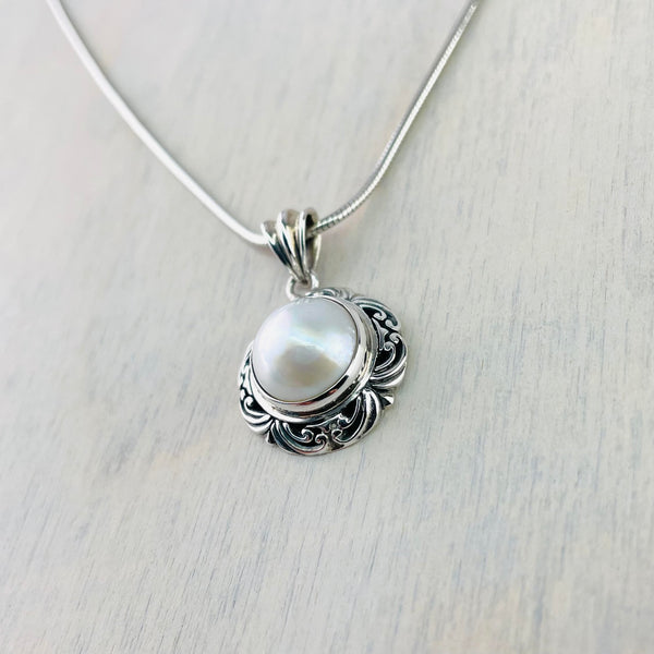 Decorative Silver and Mabe Pearl Pendant.