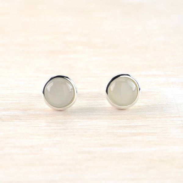 Very simple grey smooth moonstone in a round shape is set in silver.