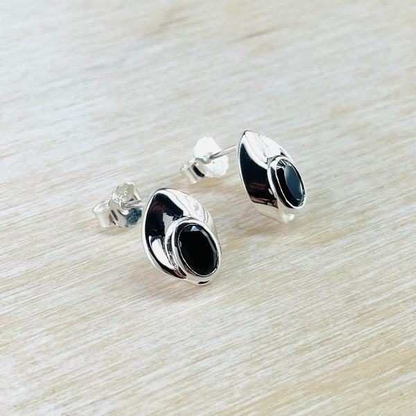 Contemporary Sterling Silver and Black Onyx Stud Earrings.
