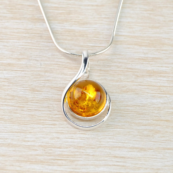 Contemporary Baltic Amber and Looped Sterling Silver Pendant.