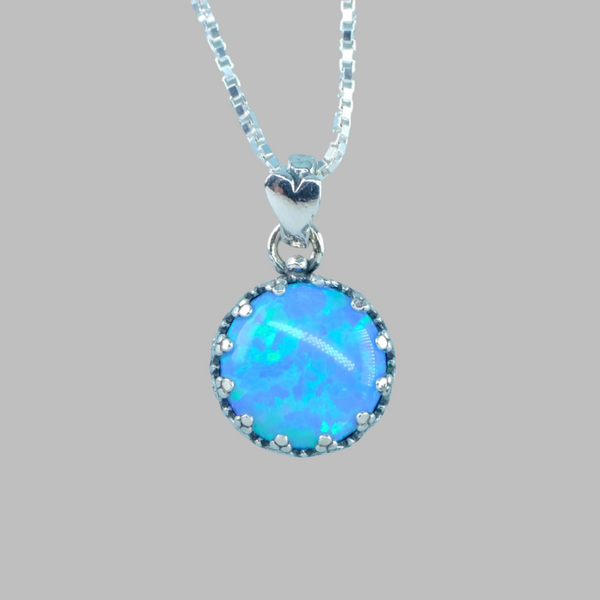 Decorated Round Sterling Silver and Opal Pendant.