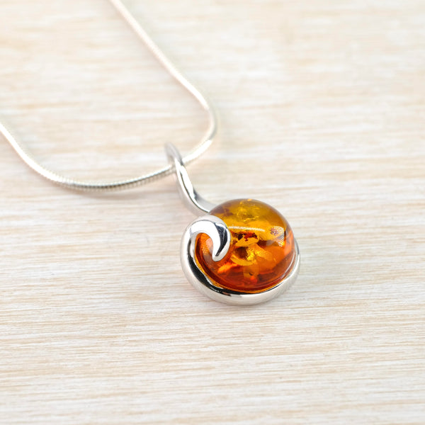 Round Amber Pendant with Sterling Silver Overlay.