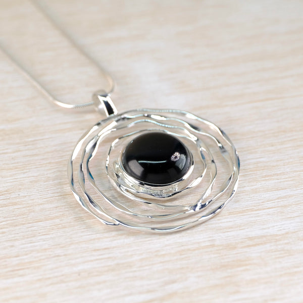 Silver Swirl and Black Onyx Pendant.
