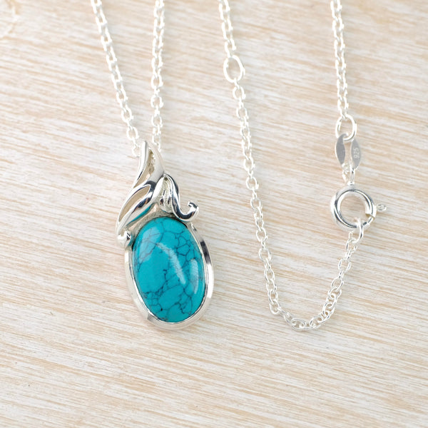 Sterling Silver and Turquoise Pendant with Decorated Top.