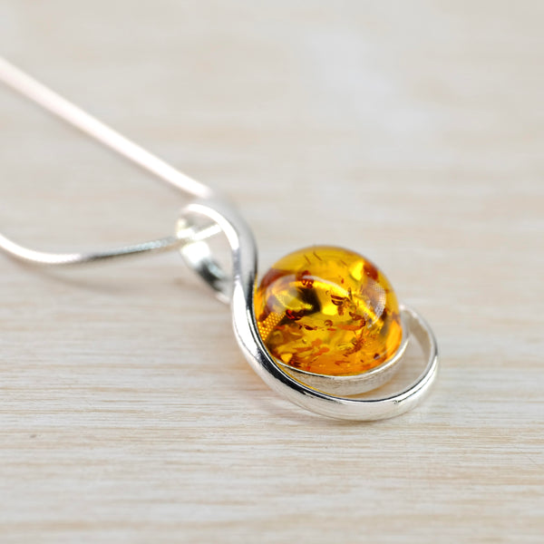 Contemporary Baltic Amber and Looped Sterling Silver Pendant.