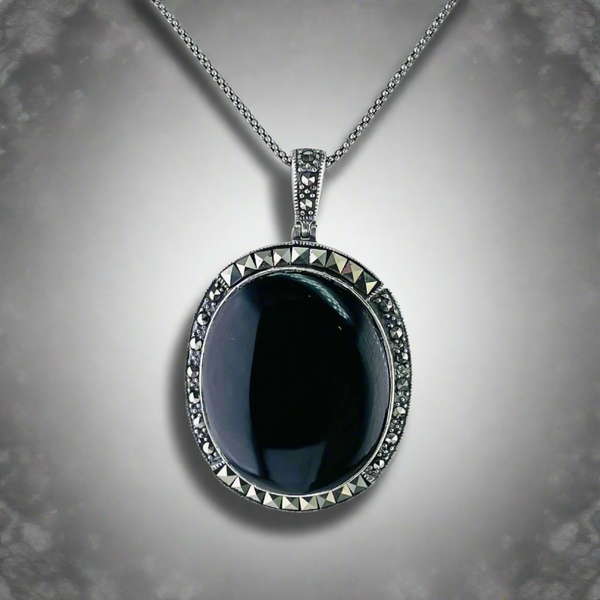 Silver, Marcasite and Black Onyx Oval Pendant.