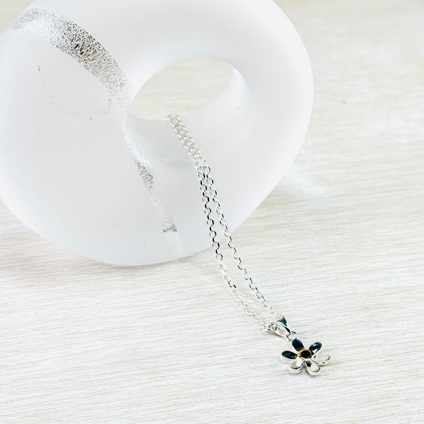 Sterling Silver and Ruby Dasiy Pendant with Gold Plated Detail.
